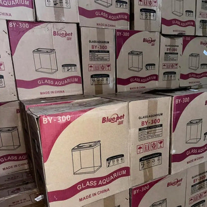 Stack of Bluepet glass aquarium boxes with visible branding and product details.